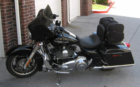 Harley Davidson with 7" Flat Solo Luggage Rack in use with a large duffle-bag fitting comfortably on the luggage rack.. For Touring Models 97-up. 